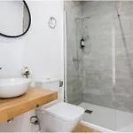 Апартаменты Atico Edificio Rianal